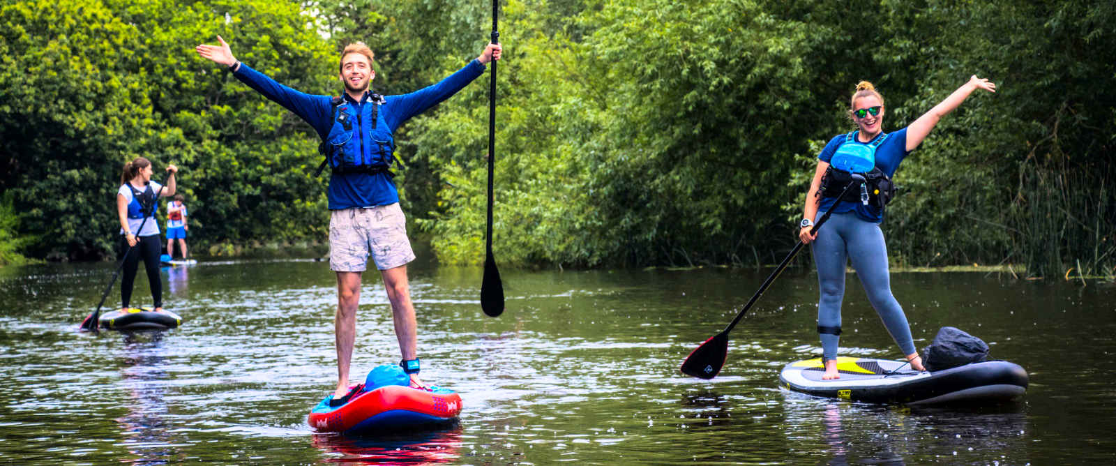Family on paddleboard safari in the Cleddau Estuary
