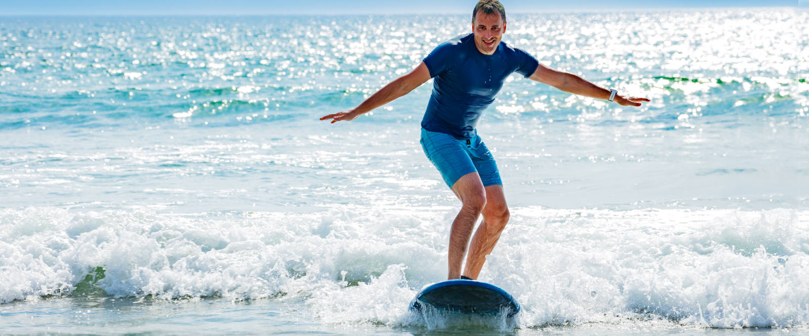 Beginner stand-up surfing at Splash! in Broad Haven